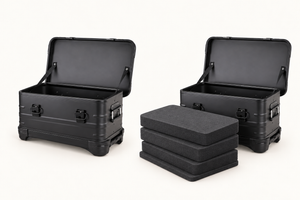 Empty black aluminum case and optional foam set: three pick-and-pluck grid layers plus a bottom pad, no lid foam