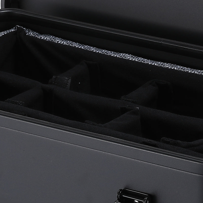 Close-up of the black padded compartments inside the removable equipment case insert