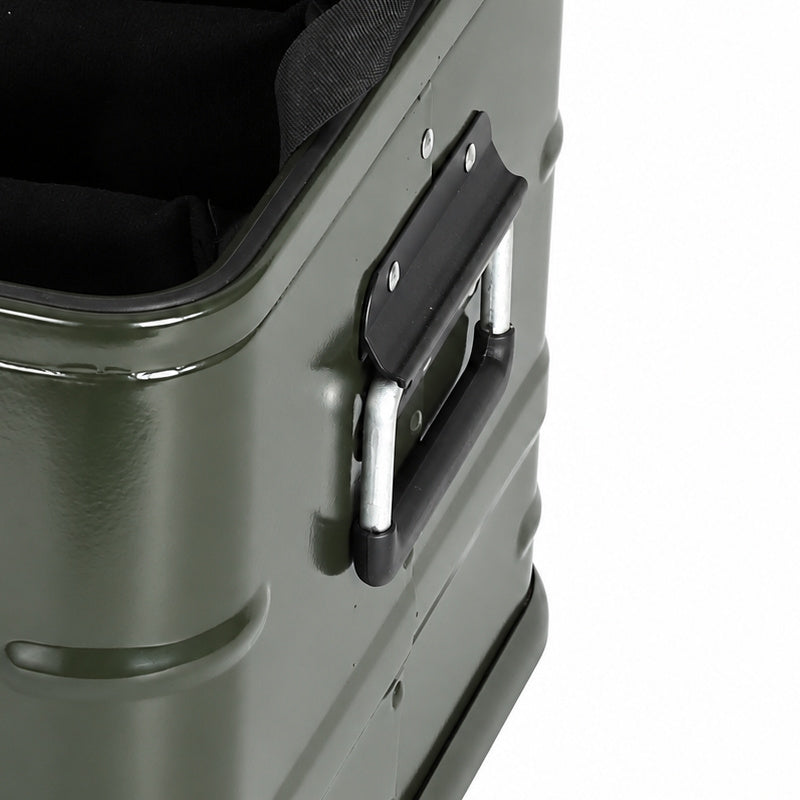 Close-up of the hinged side carry handle and metal hardware on the green aluminum case