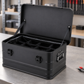 AI-created workbench scene of a black aluminum equipment case with padded dividers; meter and cable are not included