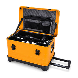 Orange rolling equipment case with padded divider insert and lid document organizer; cameras and lenses shown are not included