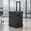 AI-created office scene of a black aluminum rolling equipment case with telescoping handle