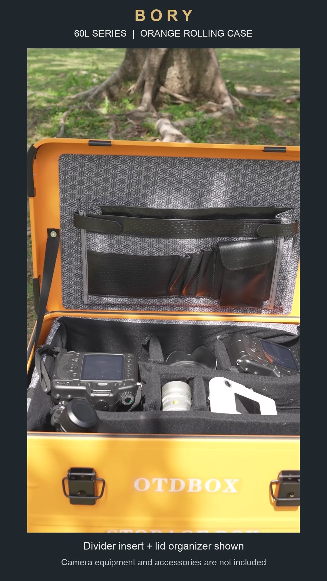 Orange 60L-series aluminum rolling case with padded dividers and lid organizer; camera equipment shown is not included